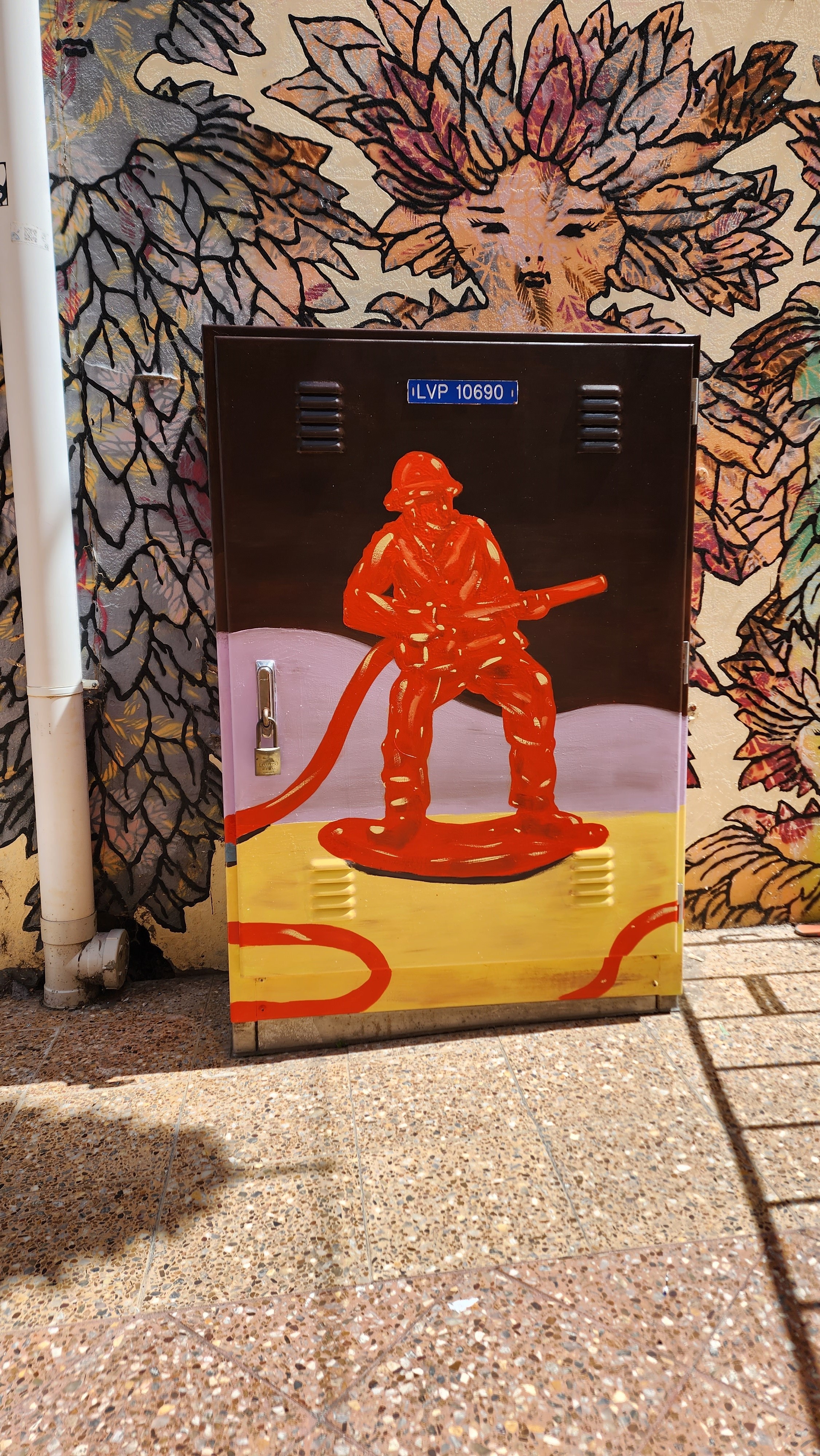 revamped electrical pillar which is painted with a fireman in Russell Lane1.jpg